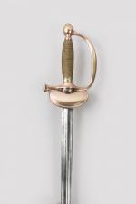 Epée d’officier subalterne, type 1816 

Fusée filigranée de laiton. Pommeau...
