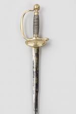 Epée d’officier subalterne, modèle 1816 

Fusée filigranée d’argent. Pommeau rond...